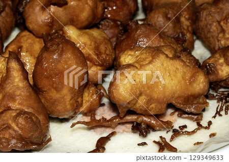 Close up of homemade chicken balls in batter fried and golden Close up of homemade chicken balls in batter fried and golden 129349633