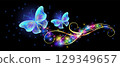 Flying blue butterflies with sparkle and blazing trail and glowing sparkle stars  in cosmic space. Animal protection day concept or birthday card. 129349657