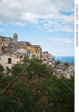 Clouds And Blue Sky Over The Small Town In Italy Clouds And Blue Sky Over The Small Town In Italy 129350071
