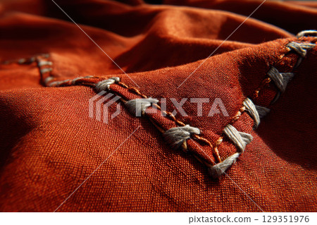 Flag threads and stitching in sunlight's glow Flag threads and stitching in sunlight's glow 129351976