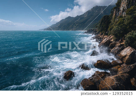 Rugged coastline with waves crashing against dramatic cliffs Rugged coastline with waves crashing against dramatic cliffs 129352015