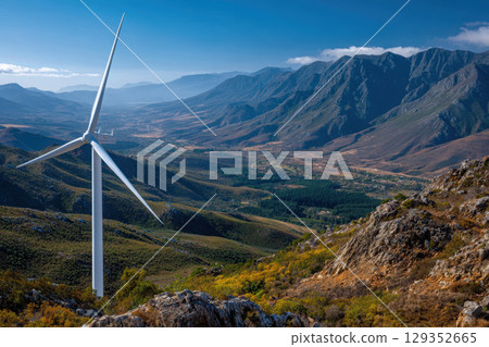 Close-up of a white wind turbine blade against mountains 129352665