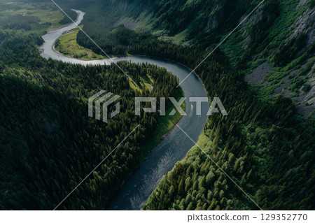 River snakes through lush forest in high contrast view River snakes through lush forest in high contrast view 129352770