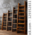 Ladders represent equity in opportunities on a textured wall 129352831