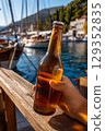 Chilled Croatian beer enjoyed by the sea on a sunny vacation 129352835