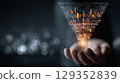 Hands present a marketing funnel with digital data overlay 129352839