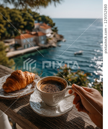 Enjoying Croatian coffee and croissant with a sea view 129352980