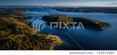 Drone view of Croatian islands with blue sea and sailboats 129352988