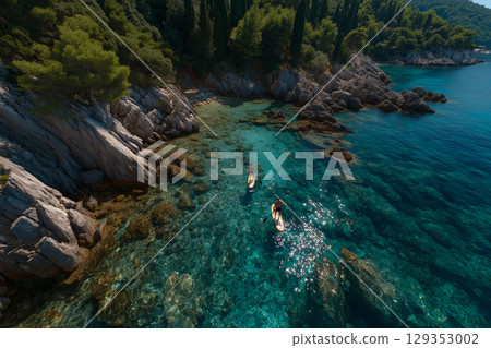 Paddleboarding along the stunning Croatian coastline 129353002