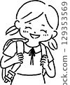 Smiling girl carrying a parcel 129353569