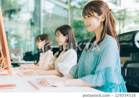 College students using computers in class 129354516