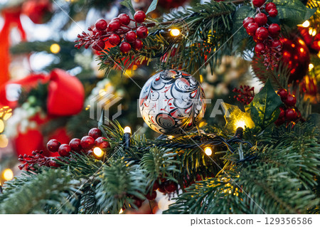 New Year's colorful trees in front of the Central Department Store in Moscow on Kuznetsky Most 129356586