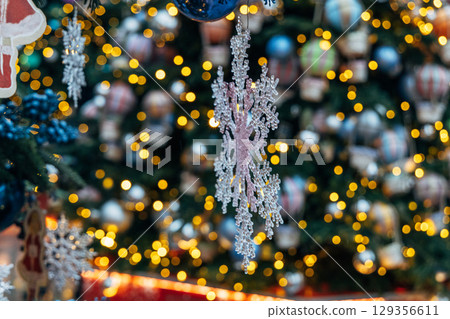 New Year's colorful trees in front of the Central Department Store in Moscow on Kuznetsky Most 129356611