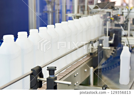 Plastic bottles in filling machine 129356813