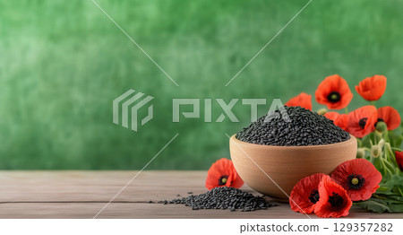 Wooden bowl full of poppy seeds with red flowers scattered on teal wood background Wooden bowl full of poppy seeds with red flowers scattered on teal wood background 129357282