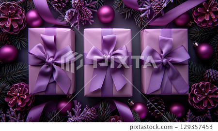 Closeup craft yellow gift box purple holiday background, copy space, banner Merry Christmas New Year 129357453