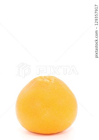 Whole grapefruit on a light background 129357917