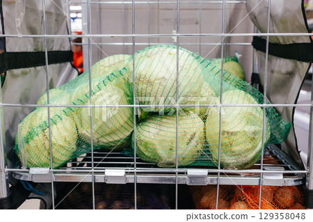 Big cart of cabbage in the mall. White cabbage. Vegetable store 129358048