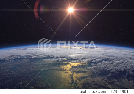 Sunrise over planet Earth, view from space. Space scene. 129359011