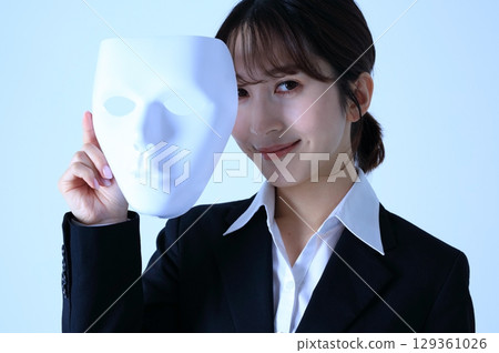 Image of a female office worker wearing a mask 129361026