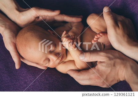 A newborn baby is wrapped in diapers with a wool cap in a basket. Swaddling, maternity hospital, family, ivf, life planning, parenting. A mother's love for her child. Baby food. High quality photo A newborn baby is wrapped in diapers with a wool cap in a basket. Swaddling, maternity hospital, family, ivf, life planning, parenting. A mother's love for her child. Baby food. High quality photo 129361121