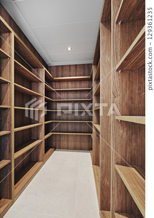 Modern empty walk-in wardrobe interior Modern empty walk-in wardrobe interior 129361235
