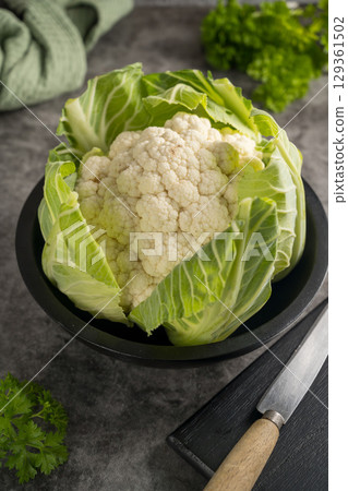 Whole white cauliflower cabbage, healthy fresh vegetable Whole white cauliflower cabbage, healthy fresh vegetable 129361502