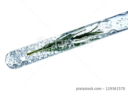 The texture of the serum with bubbles and rosemary in a test tube. The texture of the serum with bubbles and rosemary in a test tube. 129361578