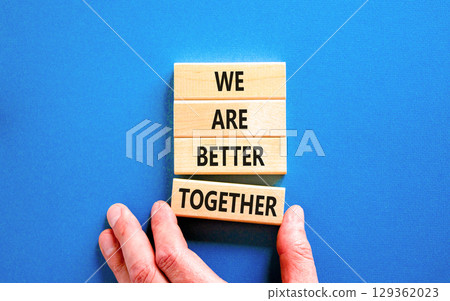 We are better together symbol. Concept words phrase We are better together on beautiful wooden blocks. Beautiful blue background. Businessman hand. Business We are better together concept. Copy space We are better together symbol. Concept words phrase We are better together on beautiful wooden blocks. Beautiful blue background. Businessman hand. Business We are better together concept. Copy space 129362023
