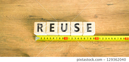 Reuse symbol. Concept word Reuse on beautiful wooden blocks. Beautiful wooden table wooden background. Beautiful yellow ruler. Business lifestyle ecological reuse concept. Copy space. Reuse symbol. Concept word Reuse on beautiful wooden blocks. Beautiful wooden table wooden background. Beautiful yellow ruler. Business lifestyle ecological reuse concept. Copy space. 129362040