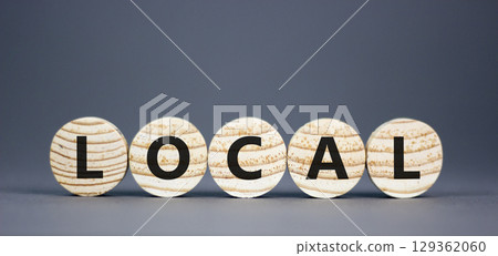 Local symbol. Concept word Local on beautiful wooden circles. Beautiful grey table grey background. Business lifestyle local concept. Copy space. 129362060