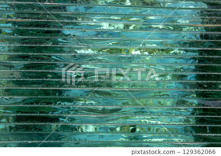 Glass Stacking Side View concept. Glass Factory produces a variety of transparent glass thicknesses. Beautiful typography background. Copy space. Glass Stacking Side View concept. Glass Factory produces a variety of transparent glass thicknesses. Beautiful typography background. Copy space. 129362066