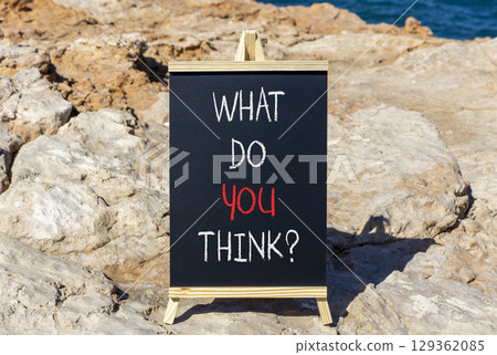 What do you think symbol. Concept words What do you think on beautiful black blackboard. Beautiful stone and blue sea background. Business and What do you think concept. Copy space. What do you think symbol. Concept words What do you think on beautiful black blackboard. Beautiful stone and blue sea background. Business and What do you think concept. Copy space. 129362085