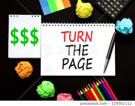 Turn the page symbol. Concept words Turn the page on beautiful white note. Black pen. Calculator. Beautiful black background. Business motivational lifestyle turn the page concept. Copy space. 129362112