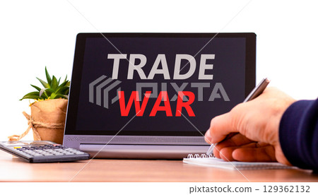 Trade war symbol. Concept word Trade war on beautiful black tablet. Businessman's hand with pen. Calculator. Beautiful white background. Business trade war concept. Copy space. Trade war symbol. Concept word Trade war on beautiful black tablet. Businessman's hand with pen. Calculator. Beautiful white background. Business trade war concept. Copy space. 129362132