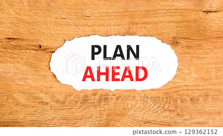 Plan ahead symbol. Concept word Plan ahead on beautiful white paper. Beautiful wooden paper background. Business plan ahead concept. Copy space. 129362152