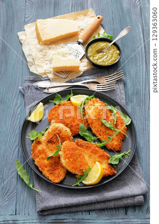 crispy parmesan crusted chicken cutlets, top view crispy parmesan crusted chicken cutlets, top view 129363060