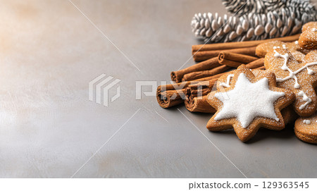 Star shaped gingerbread cookies with cinnamon and pine cones 129363545