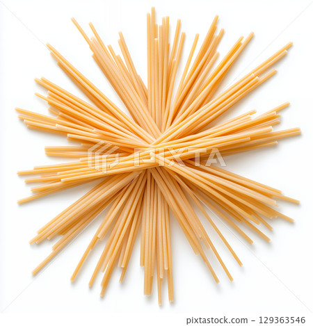 Starburst pattern of dried pasta on white background 129363546