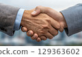 Business handshake symbolizing partnership and agreement 129363602