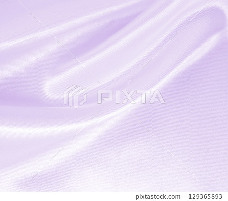 Smooth elegant lilac silk or satin texture as wedding background. Luxurious background design 129365893