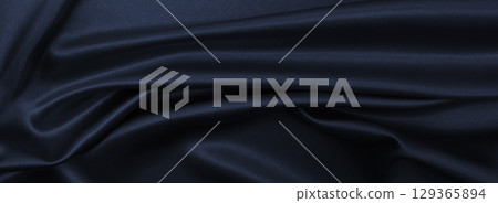 Smooth elegant dark grey silk or satin texture as abstract background. Luxurious background design 129365894