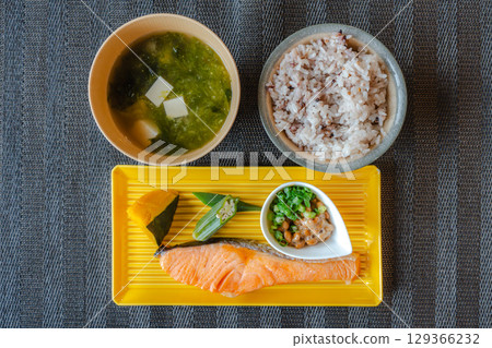 A healthy Japanese breakfast of grilled salmon, natto, and mixed grain rice A healthy Japanese breakfast of grilled salmon, natto, and mixed grain rice 129366232