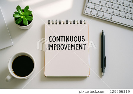 Top view of Continuous Improvement on white notepad representing Practices to Drive Innovation Across All Departments 129366319