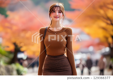 Cutout illustration of a woman enjoying an autumn trip 129366377