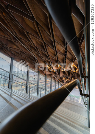 Geometric timber ceiling and stairs at Hoshakuji Station 129367389