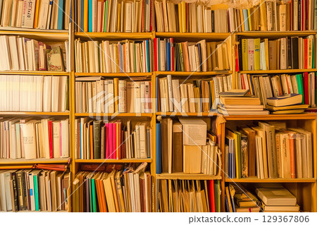 Stock photo showing the texture of a pile of unread books and paper 129367806