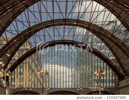 the distinctive architecture of Canary Wharf DLR Station, part of London's Docklands Light Railway (DLR) network. 129367890