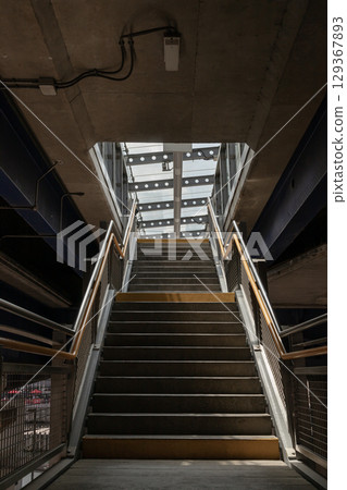Looking up a set of stairs within a structure of Canary Wharf DLR Station. Looking up a set of stairs within a structure of Canary Wharf DLR Station. 129367893