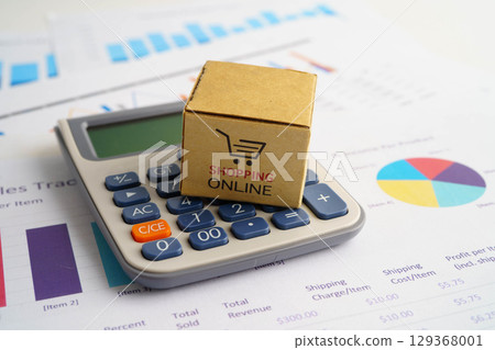Online shopping, Shopping cart box on calculator, import export, finance commerce. 129368001